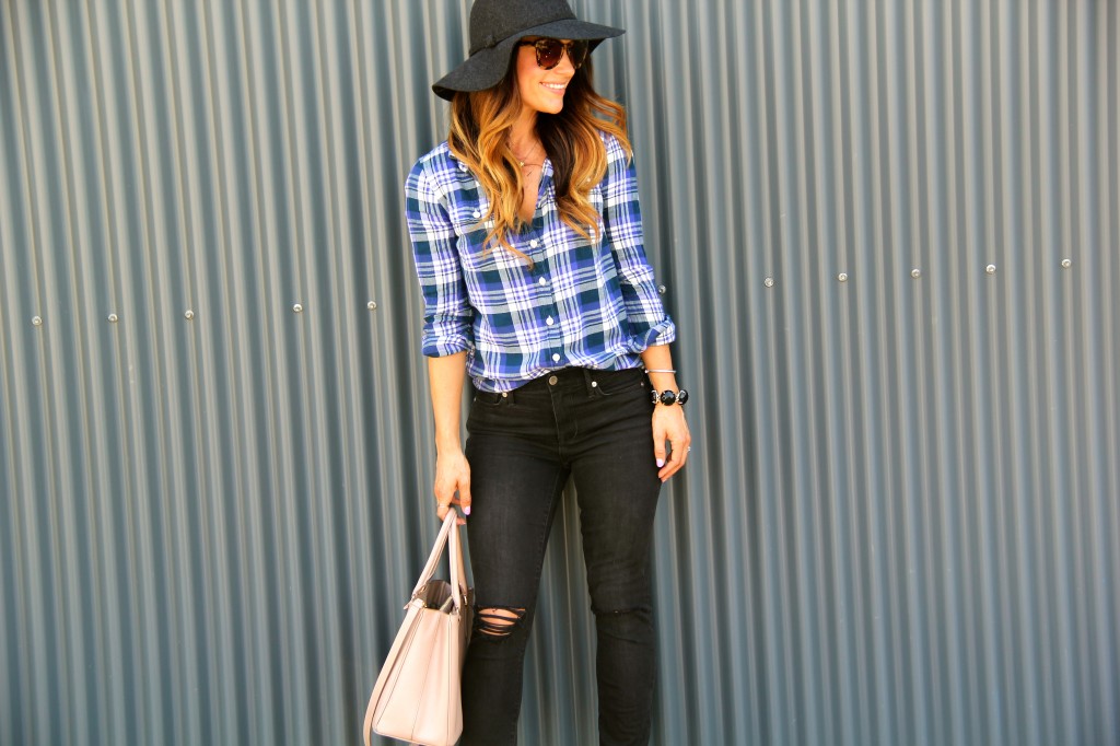 distressed denim, plaid top, floppy hat 